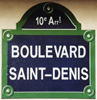 Gadeskilt i Paris med angivelse af arrondissement foroven.